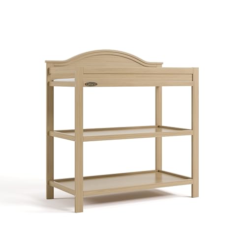 Graco Story Changing Table with Water-Resistant Pad – GREENGUARD Gold Certified Baby Changing Station with Safety Strap, 2 Open Shelves, and a Nursery Must-Have Design (Driftwood)
