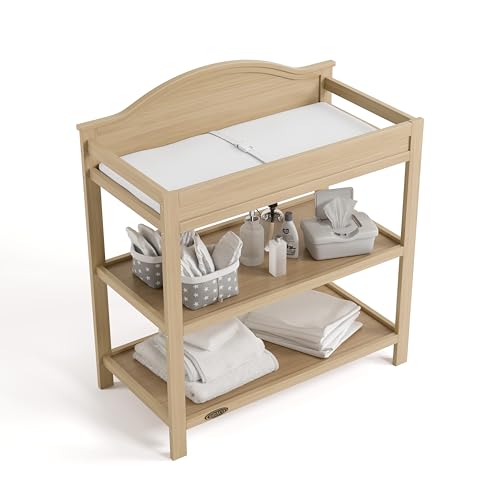 Graco Story Changing Table with Water-Resistant Pad – GREENGUARD Gold Certified Baby Changing Station with Safety Strap, 2 Open Shelves, and a Nursery Must-Have Design (Driftwood)
