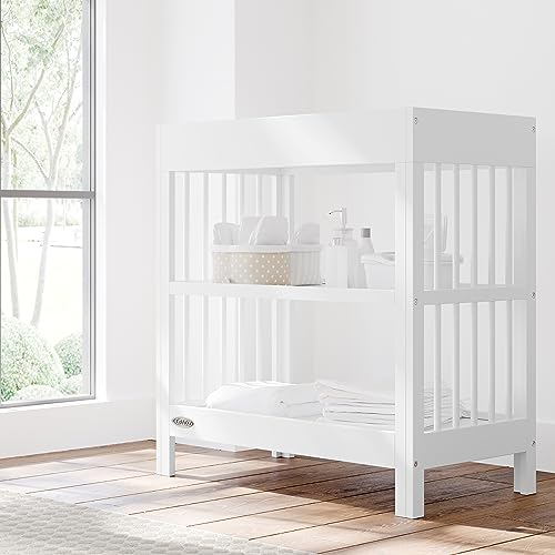 Graco Teddi Changing Table with Water-Resistant Changing Pad (White) - GREENGUARD Gold Certified, Includes Bonus Water-Resistant Changing Pad with Safety Strap, 2 Shelves, Easy-to-Match