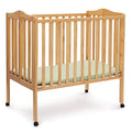 Delta Children Folding Portable Mini Baby Crib with 1.5-inch Mattress - Greenguard Gold Certified, Natural