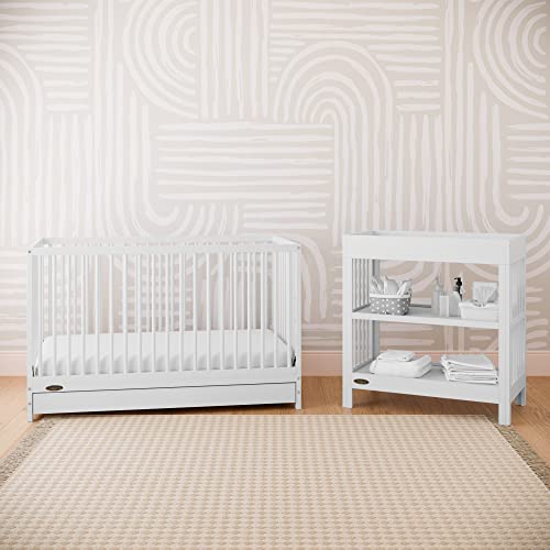 Graco Teddi Changing Table with Water-Resistant Changing Pad (White) - GREENGUARD Gold Certified, Includes Bonus Water-Resistant Changing Pad with Safety Strap, 2 Shelves, Easy-to-Match