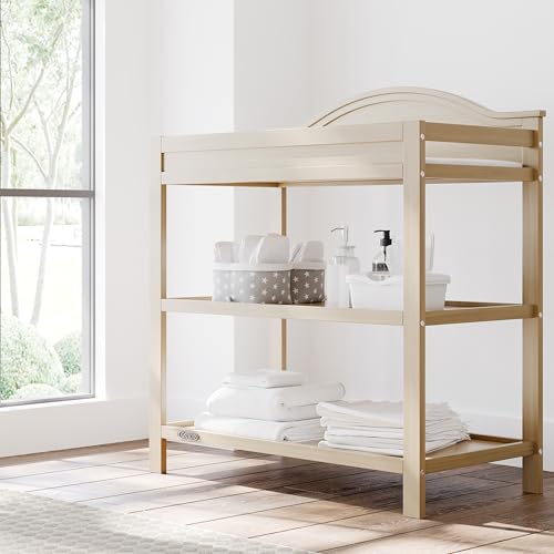 Graco Story Changing Table with Water-Resistant Pad – GREENGUARD Gold Certified Baby Changing Station with Safety Strap, 2 Open Shelves, and a Nursery Must-Have Design (Driftwood)