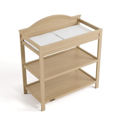 Graco Story Changing Table with Water-Resistant Pad – GREENGUARD Gold Certified Baby Changing Station with Safety Strap, 2 Open Shelves, and a Nursery Must-Have Design (Driftwood)