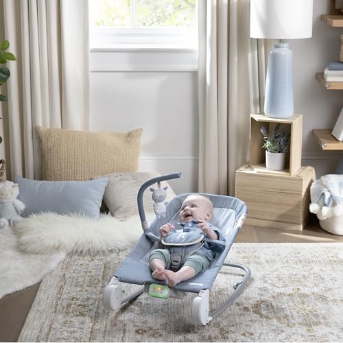 Ingenuity Gas Relief and Anti-Colic Baby Bouncer Seat and Rocker, Gentle Belly Massage to Relax and Soothe Bellies, Instant Tummy Soother, 20 Songs and Melodies – Chambray Blue