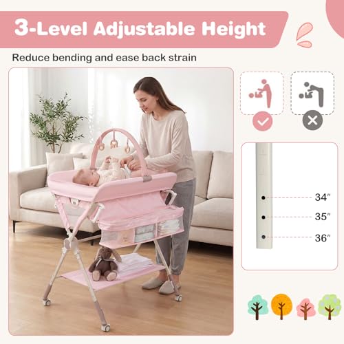 BABY JOY Portable Baby Changing Table, Foldable Diaper Changing Station with Wheels, Adjustable Height, Large Storage Rack, Removable Activity Arch, Mobile Nursery Organizer for Newborn Infant (Pink)