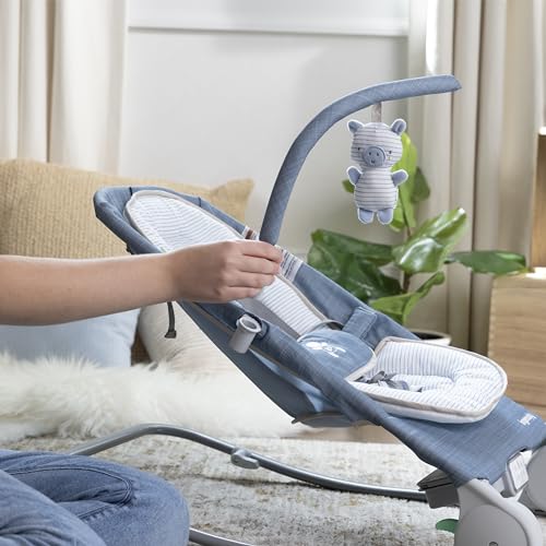 Ingenuity Gas Relief and Anti-Colic Baby Bouncer Seat and Rocker, Gentle Belly Massage to Relax and Soothe Bellies, Instant Tummy Soother, 20 Songs and Melodies – Chambray Blue