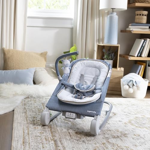 Ingenuity Gas Relief and Anti-Colic Baby Bouncer Seat and Rocker, Gentle Belly Massage to Relax and Soothe Bellies, Instant Tummy Soother, 20 Songs and Melodies – Chambray Blue